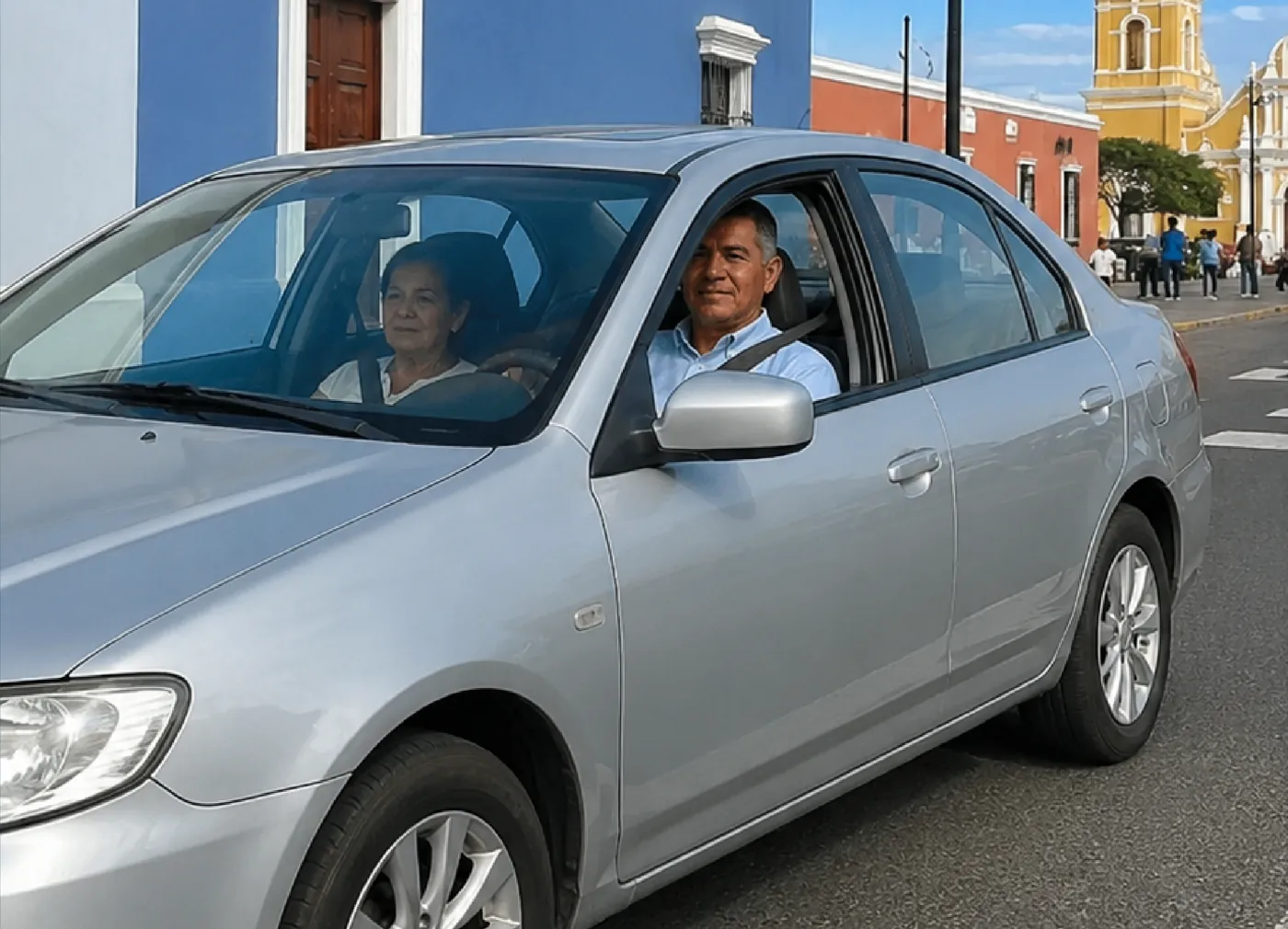 Conductor y acompañante en un automóvil circulando por la ciudad